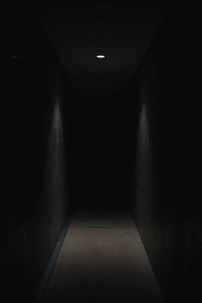Dark corridor showing need for motion sensor lights UK to prevent falls