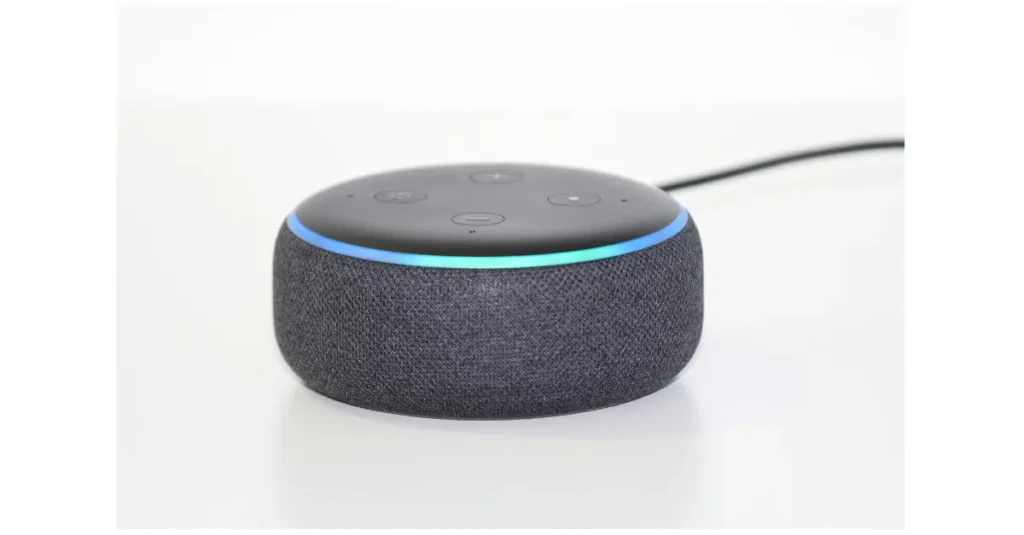 Amazon Echo Dot smart speaker on a kitchen worktop showing Alexa for seniors